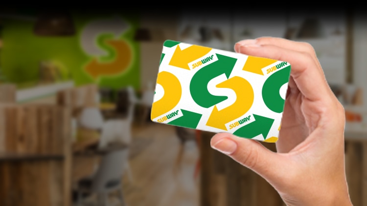 Image of a hand holding a Subway® gift card.