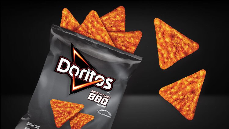 Open Bag of Doritos® with Chips Spilling Out 