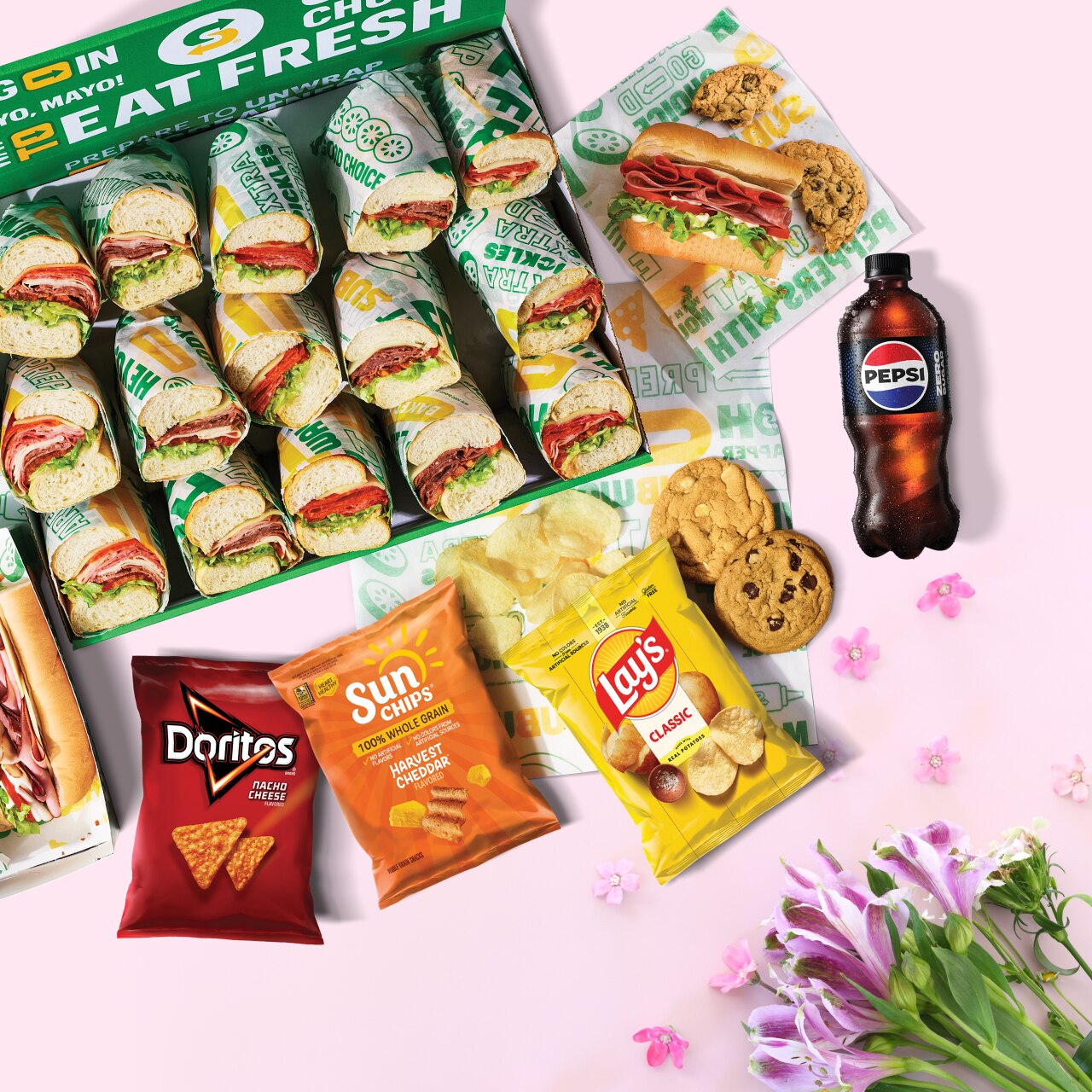 Platter of Subway catering subs, chips & drinks.